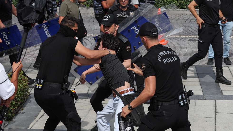 epa12361982 Turkish police block detain a protester as they set up barricades in front of the country's main opposition, the Republican People's Party (CHP) headquarters in Istanbul, Turkey, 08 September 2025. Police barricaded areas around the CHP headquarters in Istanbul as government appointed-trustees entered the building after a court's order ousted the party's Istanbul head, Ozgur Celik, over congress irregularities on 02 September 2025.  EPA/CAN OZER