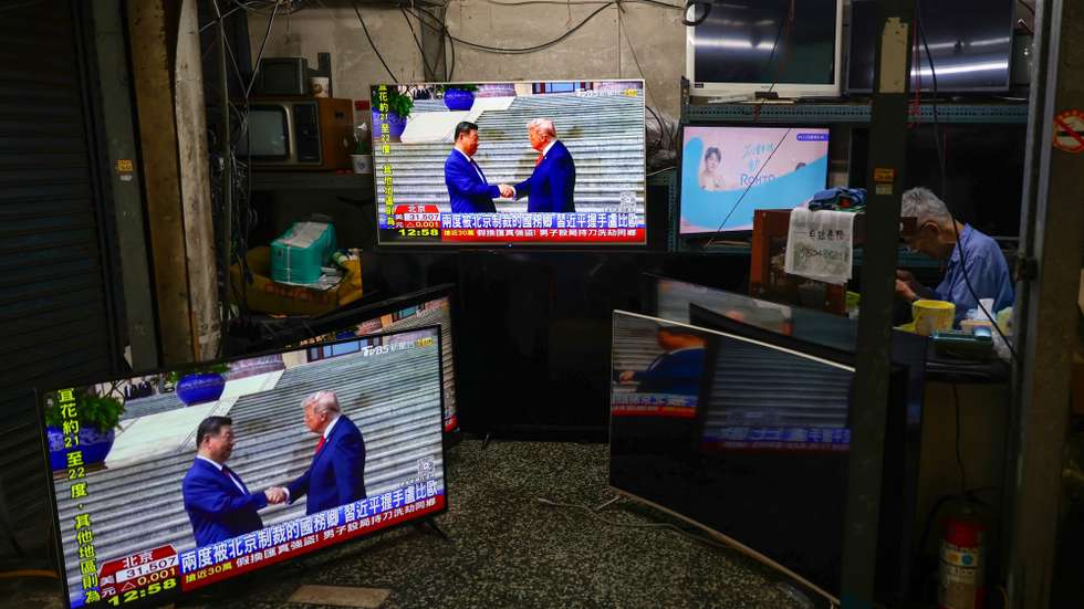 epa12955799 A man sits inside a secondhand and TV repair store, with TV screens broadcasting the Beijing meeting between US President Donald Trump and Chinese President Xi Jinping, in Taipei, Taiwan, 14 May 2026. During President Trump's state visit to China, he and Chinese President Xi are expected to discuss bilateral relations and a range of issues, notably US arms sales to Taiwan.  EPA/RITCHIE B. TONGO