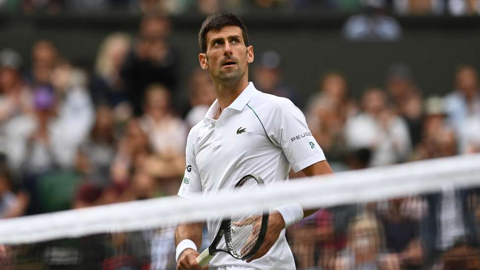 epa09324030 Novak Djokovic of Serbia reacts after winning his round of 16 match against Cristian Garin of Chile at the Wimbledon Championships, Wimbledon, Britain 05 July 2021.  EPA/NEIL HALL EDITORIAL USE ONLY  EDITORIAL USE ONLY  EDITORIAL USE ONLY