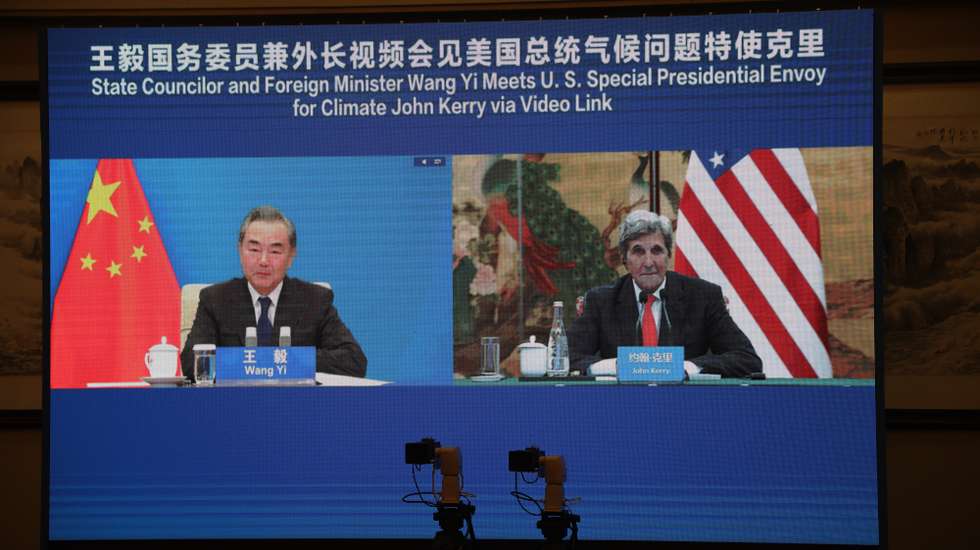 epa09442070 A handout photo made available by the US Department of State shows US Special Presidential Envoy for Climate John Kerry (R) and China's State Councilor and Foreign Minister Wang Yi are seen on a screen during their meeting via video link as John Kerry visits Tianjin, China, 01 September 2021. Special Presidential Envoy for Climate John Kerry visits China to discuss curbing emissions and fossil fuels among other climate issues.  EPA/US Department of State HANDOUT  HANDOUT EDITORIAL USE ONLY/NO SALES
