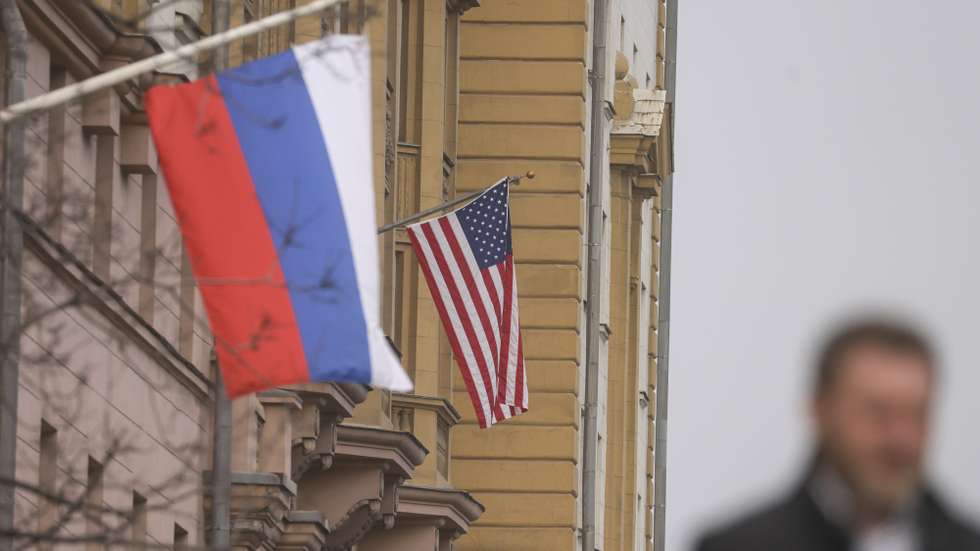 epaselect epa11958141 A man walks near Russian (front) and US flags hanging on the main building of the US Embassy in Moscow, Russia, 12 March 2025. The Kremlin expects the US to inform Russia about the results of the US-Ukrainian talks in Jeddah, and does not rule out a telephone conversation between Presidents Vladimir Putin and Donald Trump, said Dmitry Peskov, the press secretary of the head of the Russian state. As a result of the talks between the American and Ukrainian sides in Saudi Arabia, Kyiv agreed to a 30-day truce in the conflict in Ukraine.  EPA/SERGEI ILNITSKY
