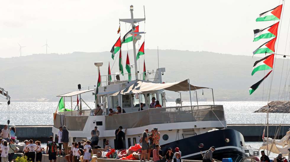 epa12372801 Participants of the Global Sumud Flotilla (GSF) wait to set sail towards Gaza along with other boats at the port of Bizerte, Tunisia, 13 September 2025. The Gaza-bound GSF flotilla is an international maritime initiative that began sailing in August 2025, aiming to break the Israeli blockade and deliver vital aid to the Gaza Strip.  EPA/MOHAMED MESSARA