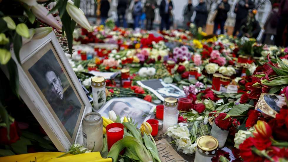 epa11170434 A photo showing late Russian opposition leader Alexei Navalny sits among floral tributes outside the Russian embassy in Berlin, Germany, 21 February 2024. Outspoken Kremlin critic Alexei Navalny died in a penal colony, the Federal Penitentiary Service of the Yamalo-Nenets Autonomous District announced on 16 February 2024. In late 2023 Navalny was transferred to an Arctic penal colony, considered one of the harshest prisons.  EPA/HANNIBAL HANSCHKE