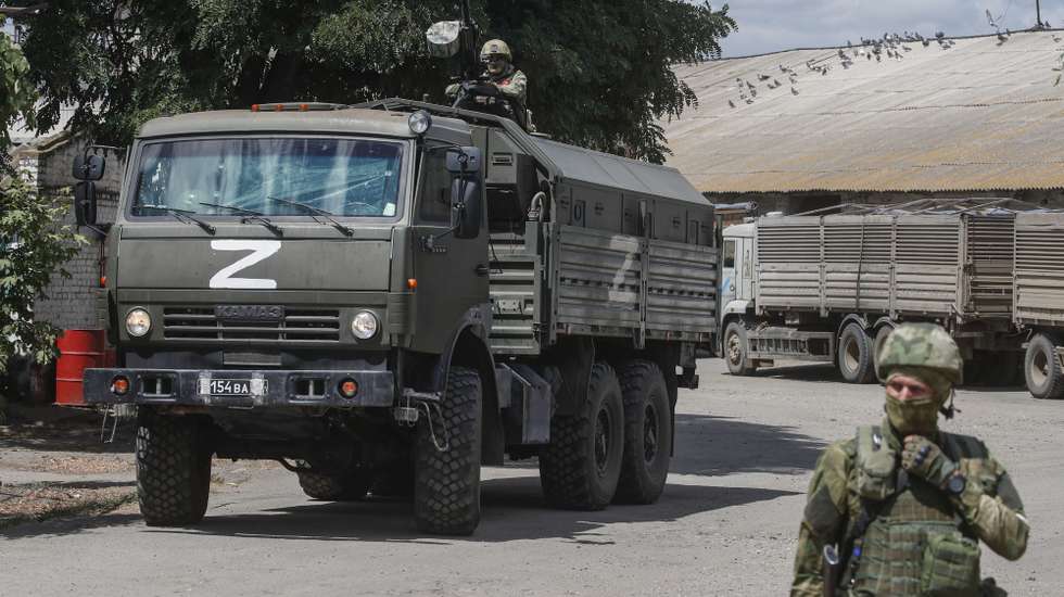 epa10072115 A picture taken during a visit to Melitopol organized by the Russian military shows Russian servicemen at a grain storage facility in Melitopol, Zaporizhia region, southeastern Ukraine, 14 July 2022. (issued 15 July 2022). The conflict in Ukraine has affected the availability and price of wheat worldwide. Melitopol is under the control of Russian forces and the city is administered by a military-civilian administration. On 24 February 2022 Russian troops entered the Ukrainian territory in what the Russian president declared a 'Special Military Operation', starting an armed conflict that has provoked destruction and a humanitarian crisis. The letter Z, painted on Russian military vehicles in Ukraine, has become a symbol of support for the Russian army.  EPA/SERGEI ILNITSKY