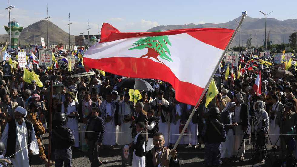 epa11642361 A Houthi supporter waves a Lebanese flag during a protest in solidarity with the Lebanese and Palestinian people in Sana'a, Yemen, 04 October 2024. Thousands of people participated in the protest in solidarity with the Lebanese and Palestinian people and to condemn the US support for Israel's military operations in Lebanon and the Gaza Strip, amid the escalation of the Houthis' shipping attacks in the seas around Yemen and on targets in Israel. Yemen's Houthis have escalated missile and drone attacks on Israeli targets after the Israeli army killed Lebanon's Hezbollah leader Hassan Nasrallah in an airstrike on Beirut on 28 September 2024.  EPA/YAHYA ARHAB