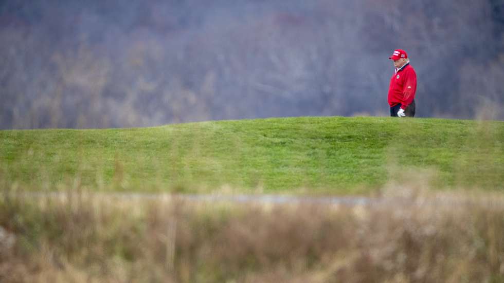 epa08847130 US President Donald J. Trump golfs at his Trump National Golf Club in Sterling, Virginia, USA, 27 November 2020. Following his round of golf President Trump boarded Marine One on the course and lifted off for Camp David where he will join his family for the weekend.  EPA/SHAWN THEW