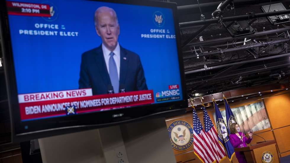epa08925263 Vice President Elect Joe Biden is seen on television as Speaker of the House Nancy Pelosi delivers remarks during a press conference inside the US Capitol in Washington, DC, USA, 07 January 2021. Speaker Pelosi called for the removal of US President Donald J. Trump either by the cabinet invoking the 25th amendment or possibly through the House taking up articles of impeachment.  EPA/SHAWN THEW
