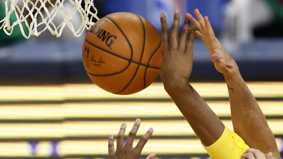 epa08983199 The Golden State Warriors and the Boston Celtics reach out for a rebound during the first half of the NBA basketball game between the Boston Celtics and the Golden State Warriors at the Chase Center, in San Francisco, California, USA, 02 February 2021.  EPA/JOHN G. MABANGLO SHUTTERSTOCK OUT