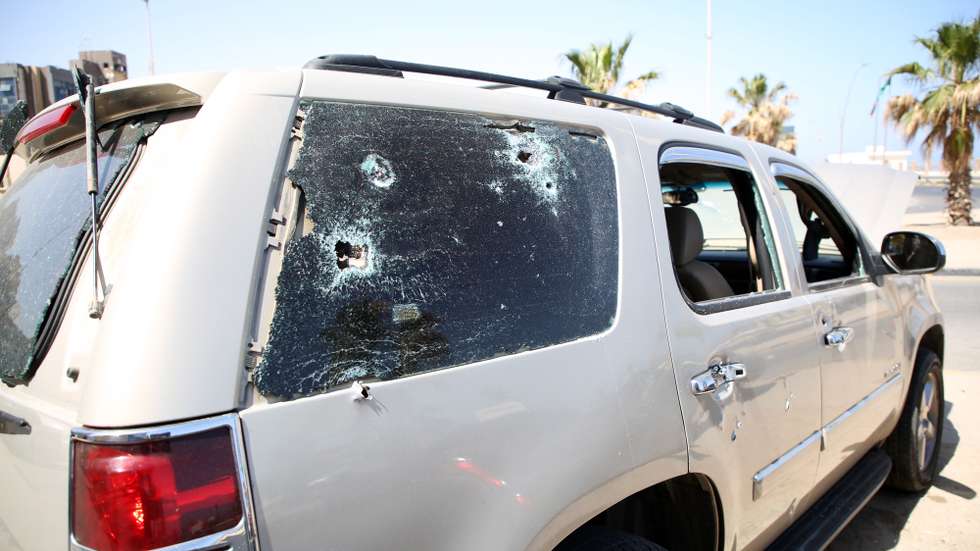 epa09952362 A damaged vehicle after overnight clashes between fighters loyal the Tripoli-based government and the Tobruk-based one in Tripoli, Libya, 17 May 2022. Clashes erupted in Tripoli on 17 May after the Tobruk-based parliament-appointed prime minister Fathi Bashagha entered Tripoli overnight and attempted to take control from the rival government led by prime minister Abdulhamid Dbeibah. Bashagha's office later announced he left the capital. Dbeibah rejects the parliament move to appoint a new prime minister saying transfer of power can only occur after elections.  EPA/STR