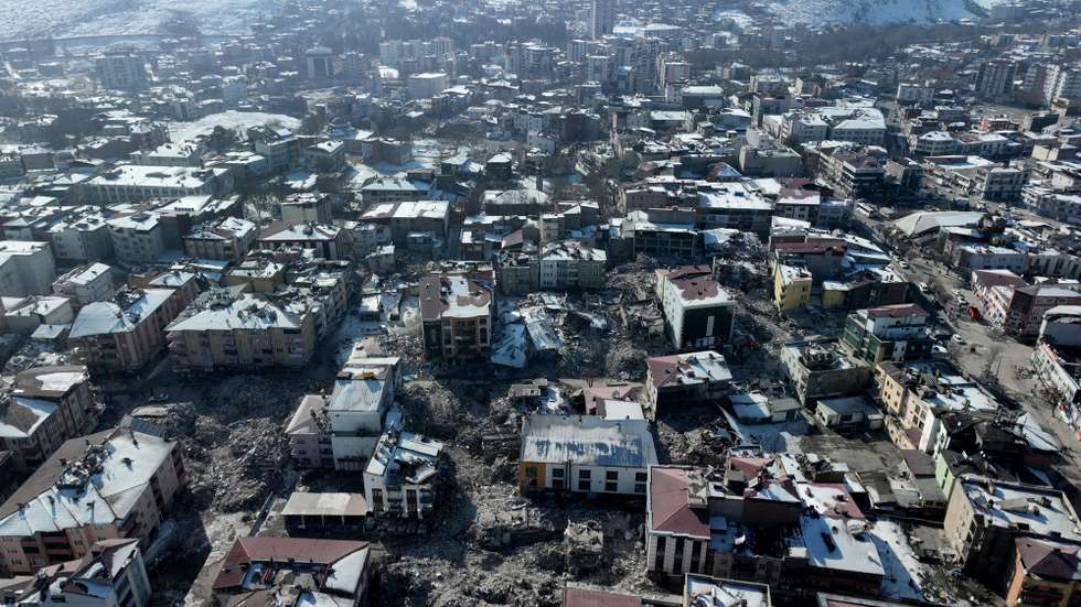 epa10472715 An aerial picture taken by drone shows a general view of collapsed buildings following a powerful earthquake in Elbistan district of Kahramanmaras, Turkey, 17 February 2023. Almost 44,000 people have died and thousands more are injured after two major earthquakes struck southern Turkey and northern Syria on 06 February. Authorities fear the death toll will keep climbing as rescuers look for survivors across the region.  EPA/TOLGA BOZOGLU