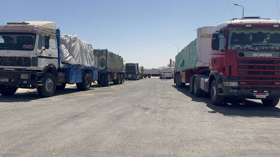 epa11468209 Trucks carrying aid going to Gaza are waiting in Al-Arish after the Rafah crossing was closed on May 7 after the Israeli army entered Rafah, Al-Arish, Egypt, 09 July 2024. Hundreds of trucks waiting for more than 60 days, some of them carry food and medical materials, part of which were spoiled due to poor storage and high temperatures. According to the Gaza government media office on 09 July, Israel has "prevented aid entry for 64 days, which threatens an increase in death due to starvation".  EPA/Mohamed Arafat