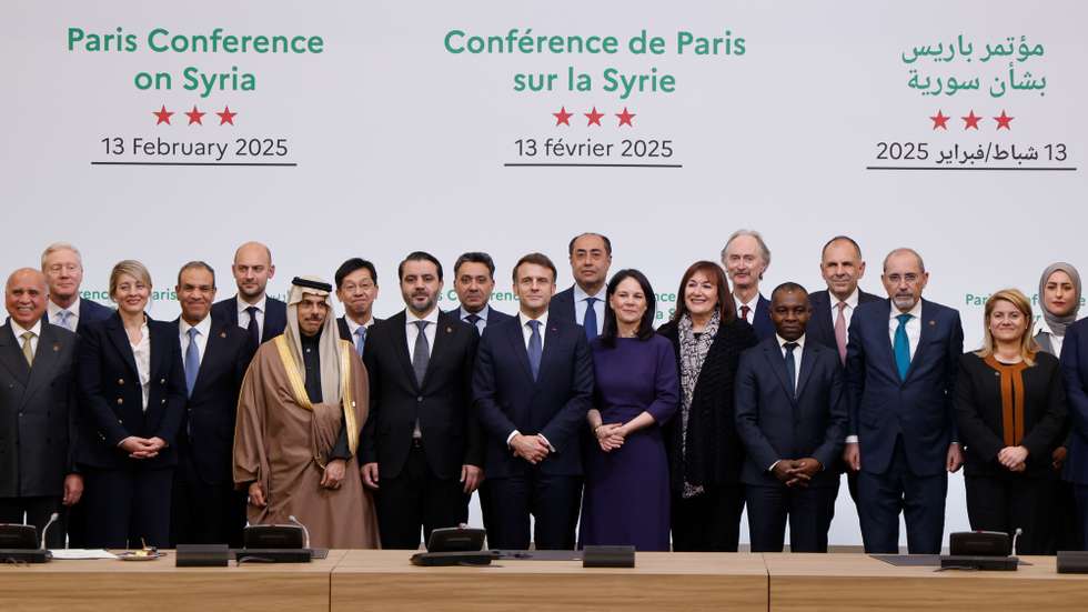 epa11893506 France's President Emmanuel Macron (C), Iraq's Minister of Foreign Affairs Fuad Hussein (L), Canada's Minister of Foreign Affairs Melanie Joly (3-L), Syria's Minister of Foreign Affairs Asaad Hassan al-Shaibani (8-L), Saudi Minister of Foreign Affairs Prince Faisal bin Farhan Al Saud (6-L), Egypt's Minister of Foreign Affairs Badr Abdelatty (4-L), France's Minister for Europe and Foreign Affairs Jean-Noel Barrot (5-L), Germany's Foreign Minister Annalena Baerbock (8-R), Italy's State secretary of the Ministry of Foreign Affairs Maria Tripodi (2-R), Japanese Parliamentary Deputy Minister Hisashi Matsumoto (7-L), Greece's Foreign Minister Giorgos Gerapetritis (4-R) and participants pose for a group photograph during the International Conference on Syria at the Ministerial Conference Center, in Paris, France, 13 February 2025.  EPA/LUDOVIC MARIN / POOL  MAXPPP OUT