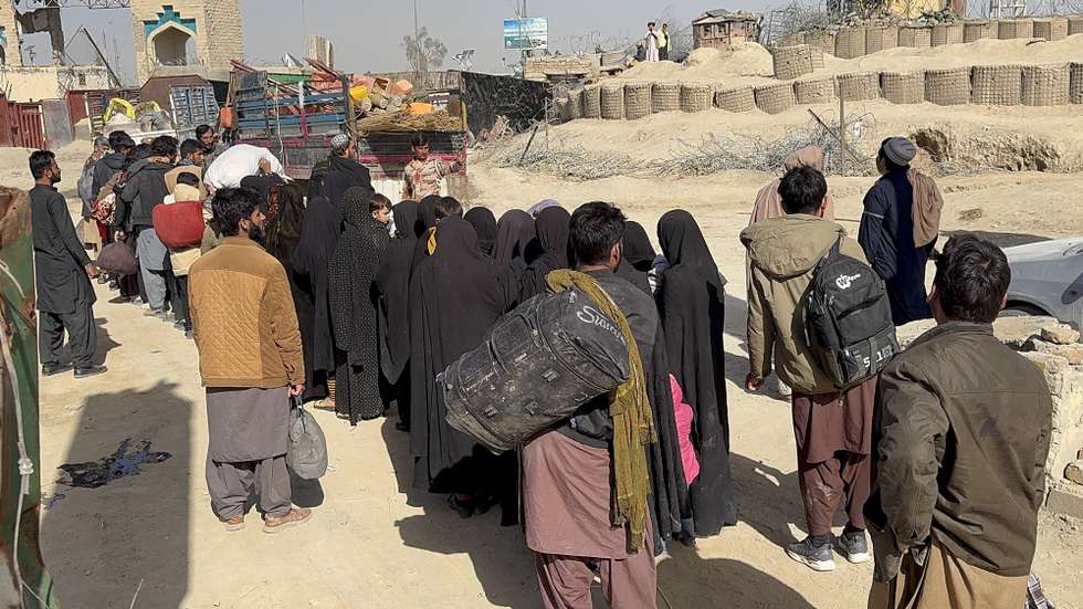 epa12772933 Afghans arrested for illegally crossing into Iran through the Pak-Iran border line up as they are sent back to Afghanistan at the Pak-Afghan border in Chaman, 24 February 2026. Turbat police arrested at least 50 Afghan nationals during a search operation for allegedly attempting to travel illegally to Iran. Authorities said the individuals had been residing in Pakistan and were planning to cross the border unlawfully. They were deported to Afghanistan via the Chaman border crossing. Police added that the crackdown on undocumented migrants has pushed some Afghans to try moving to Iran. The group included women and children.  EPA/AKHTAR GULFAM