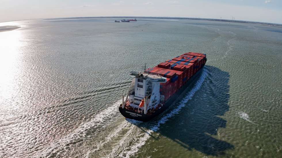 epa12821993 A view of the Independent Quest a container ship (Imo 9246700) registered in Portugal, leaving the Antwerp harbour in Hansweert, The Netherlands, 15 March 2026. The EU Commission presented EU Industrial Maritime and Port Strategies, following the closure of the Strait of Hormuz amid the escalating regional conflict leading to growing concern over global oil supplies.  EPA/OLIVIER HOSLET