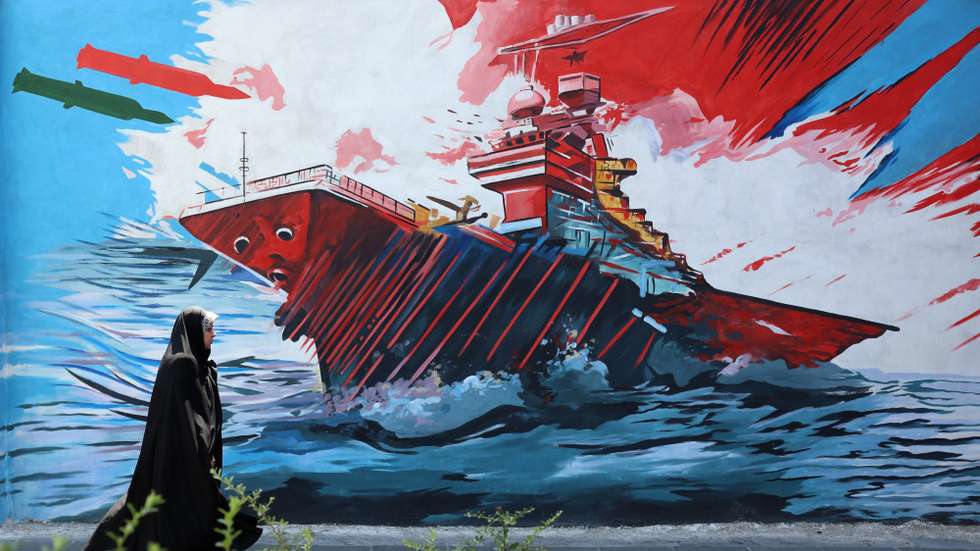 epa13012533 An Iranian woman walks next to an anti-US and Israeli mural in Tehran, Iran, 03 June 2026. Iran and the US traded strikes despite a ceasefire as the conflict involving Iran, the US, and Israel continues. According to US Central Command (CENTCOM), US forces intercepted multiple Iranian ballistic missiles and drones and conducted self-defense strikes on Qeshm Island in response to attempted attacks by Iran across the Middle East targeting US military bases.  EPA/ABEDIN TAHERKENAREH RESTRICTIONS: NO Access Israel Media/Persian Language TV Stations Outside Iran/Strictly No Access BBC Persian/VOA Persian/Manoto TV/Iran International TV. (As mandated by Iran's Directorate General for Foreign Media) --