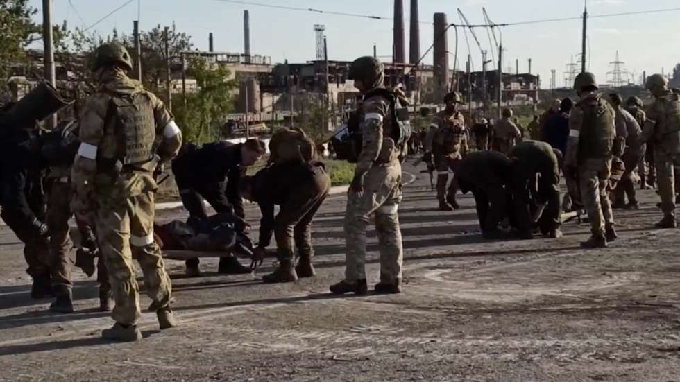 epa09952371 A handout still image taken from a handout video made available by the Russian Defence Ministry's press service shows Russian servicemen frisk Ukrainian servicemen as they are being evacuated from the besieged Azovstal steel plant in Mariupol, Ukraine, 17 May 2022. A total of 265 Ukrainian militants, including 51 seriously wounded, have laid down arms and surrendered to Russian forces, the Russian Ministry of Defence said on 17 May 2022. Those in need of medical assistance were sent for treatment to a hospital in Novoazovsk, the ministry states further. Russian President Putin on 21 April 2022 ordered his Defence Minister to not storm but to blockade the plant where a number of Ukrainian fighters were holding out. On 24 February, Russian troops invaded Ukrainian territory starting a conflict that has provoked destruction and a humanitarian crisis. According to the UNHCR, more than six million refugees have fled Ukraine, and a further 7.7 million people have been displaced internally within Ukraine since.  EPA/RUSSIAN DEFENCE MINISTRY PRESS SERVICE HANDOUT  BEST QUALITY AVAILABLE HANDOUT EDITORIAL USE ONLY/NO SALES
