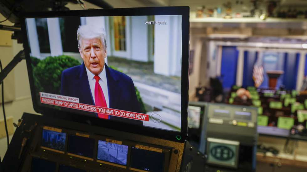 epa08923571 US President Donald J. Trump is seen delivering remarks via Twitter about the violence at the US Capitol on a television screen in the Brady press briefing room at the White House in Washington, DC, USA, 06 January 2021. Various groups of Trump supporters have broken into the US Capitol and rioted as Congress prepares to meet and certify the results of the 2020 US Presidential election.  EPA/SHAWN THEW