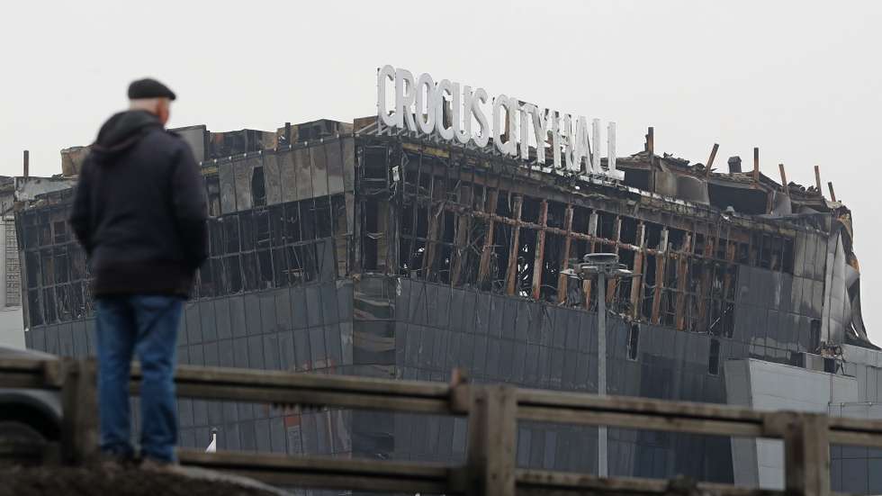 epaselect epa11241014 A person looks on the Crocus City Hall concert venue following a terrorist attack in Krasnogorsk, outside Moscow, Russia, 24 March 2024. Russia observes a day of national mourning for the victims of the terrorist attack in Crocus City Hall in Krasnogorsk. On 22 March, a group of gunmen attacked the Crocus City Hall in the Moscow region, Russian emergency services said. According to the latest data from the Russian Investigative Committee, 152 people died and more than 100 were hospitalized. On the morning of 23 March, the director of the Russian FSB, Alexander Bortnikov, reported to Russian President Vladimir Putin about the detention of 11 people, including all four terrorists directly involved in the terrorist attack.  EPA/MAXIM SHIPENKOV