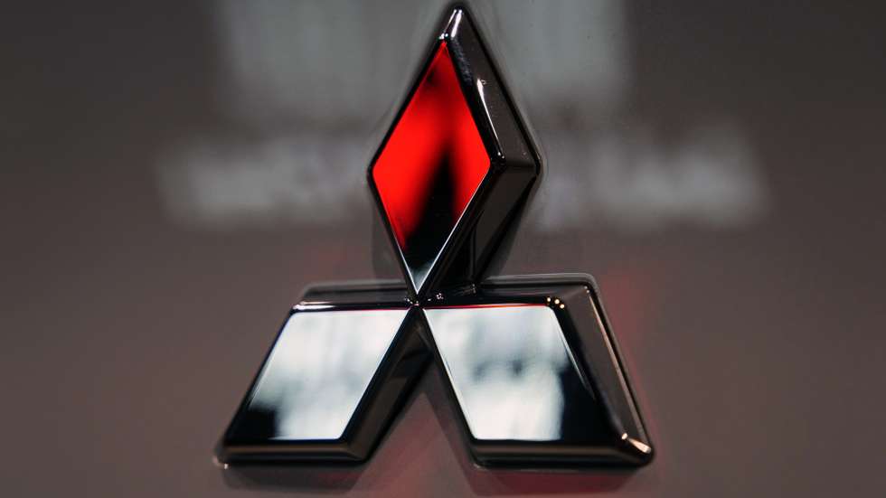 epa11326270 The Mitsubishi Motors logo is seen on a vehicle displayed at a carmaker showroom in Tokyo, Japan, 08 May 2024. Mitsubishi Motors Corporation announced its full-year financial results for FY2023, showing that its consolidated net sales for the full fiscal year rose 13 percent year on year.  EPA/FRANCK ROBICHON