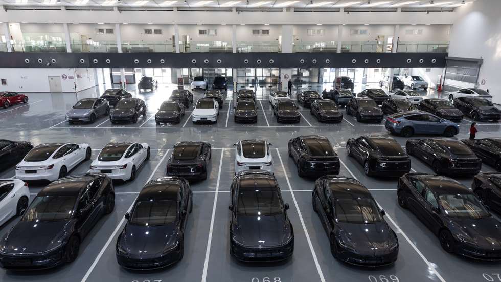 epa11927376 Tesla cars are parked at a delivery center in Beijing, China, 27 February 2025. Tesla began delivering the revised Model Y in China on 26 February. All of the cars parked in the indoor parking lot have already been sold to customers.  EPA/JESSICA LEE