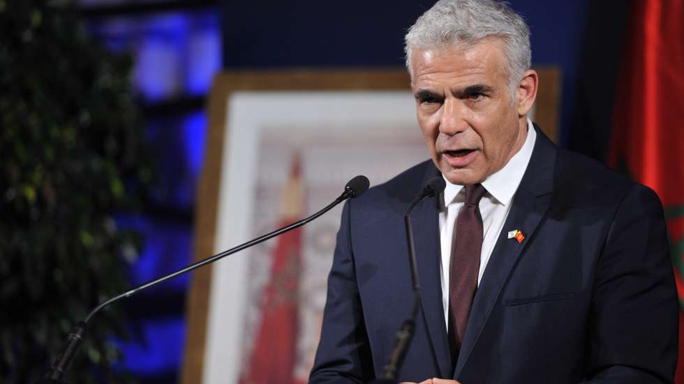 epa09411331 Israeli Foreign Minister Yair Lapid holds a press conference during the conclusion of his official visit, in Casablanca, Morocco, 12 August 2021.  EPA/JALAL MORCHIDI