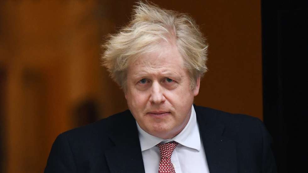 epa09775863 British Prime Minister Boris Johnson departs 10 Downing Street for parliament in London, Britain, 21 February 2022. British Prime Minister Boris Johnson is set to announce his governments 'Living with Covid' strategy, which will bring an end to all Covid-19 restrictions in England.  EPA/ANDY RAIN