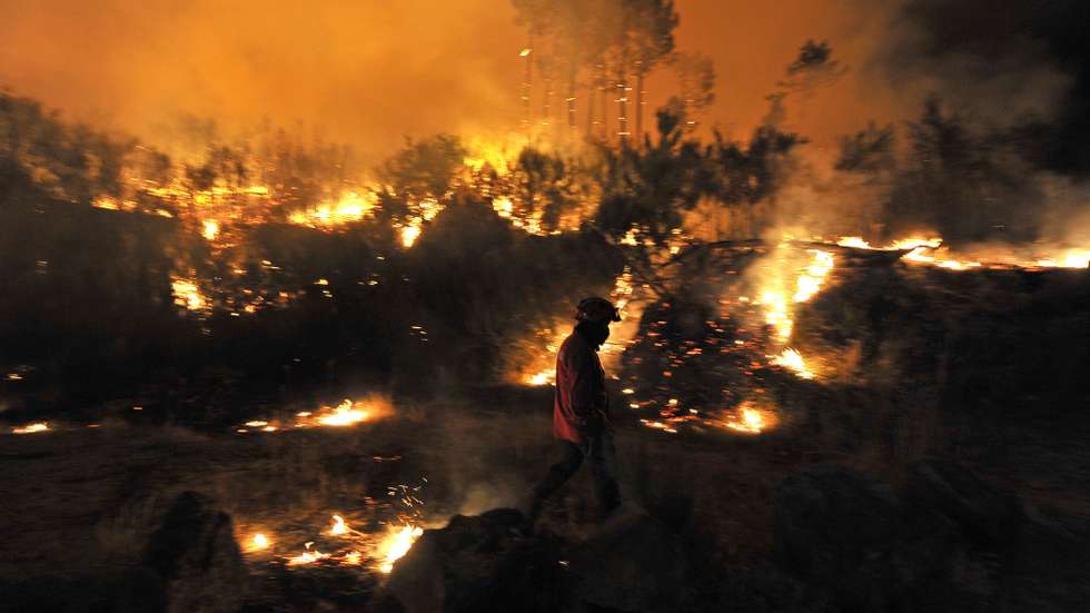 A  fireman participates in the combat of a forest fire at Vila Nova de Paiva, Portugal, 03 September 2013. This wildfire gathers 81 firemen, 24 land vehicules and 2 airplanes.  NUNO ANDRE FERREIRA/LUSA.