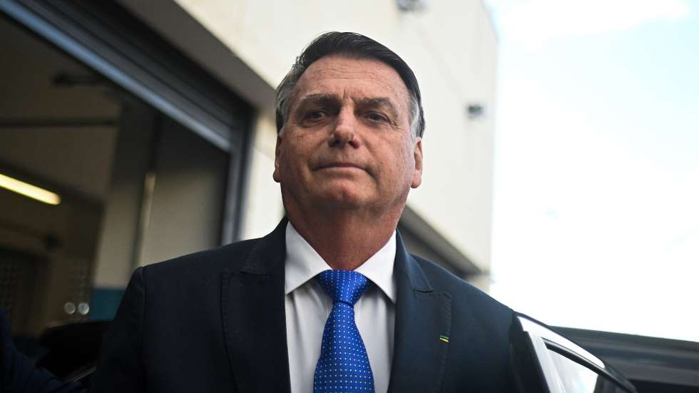 epa10742615 Former Brazilian President Jair Bolsonaro reacts after leaving the headquarter of the Federal Police in Brasilia, Brazil, 12 July 2023. Bolsonaro presented his testimony in a case of alleged coup denounced by Brazilian right-wing senator Marcos do Val.  EPA/Andre Borges