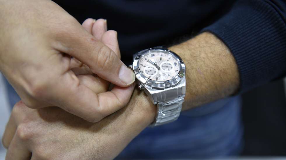 epa10545429 A man adjusts the time on his watch in Beirut, Lebanon, 27 March 2023. The decision to delay the commencement of daylight savings time from the customary last Sunday in March to at the end of Ramadan on 21 April was announced by the government of Lebanon on 23 March. On 26 March, the move sparked widespread confusion as it was opposed by several Christian institutions, including the largest church in the country, the Maronite church. Lebanese caretaker Prime Minister Najib Mikati said the Council of Ministers voted during its meeting on 27 March to move the clock forward one hour on Wednesday night 29 March.  EPA/WAEL HAMZEH