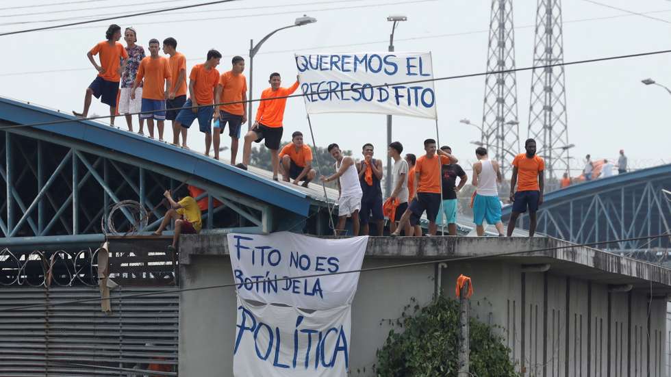 epa10800548 A group of prisoners protest at the Regional Prison of Guayaquil, in Guayaquil, Ecuador, 14 August 2023. Inmates of the Penitenciaria del Litoral and the Regional Prison of Guayaquil protested to demand the return of Aldolfo Macias 'Fito' to his original cell, identified by authorities as the leader of the criminal gang 'Los Choneros', who on 13 August was taken from the Regional Prison to the maximum security prison, called La Roca.  EPA/Jonathan Miranda