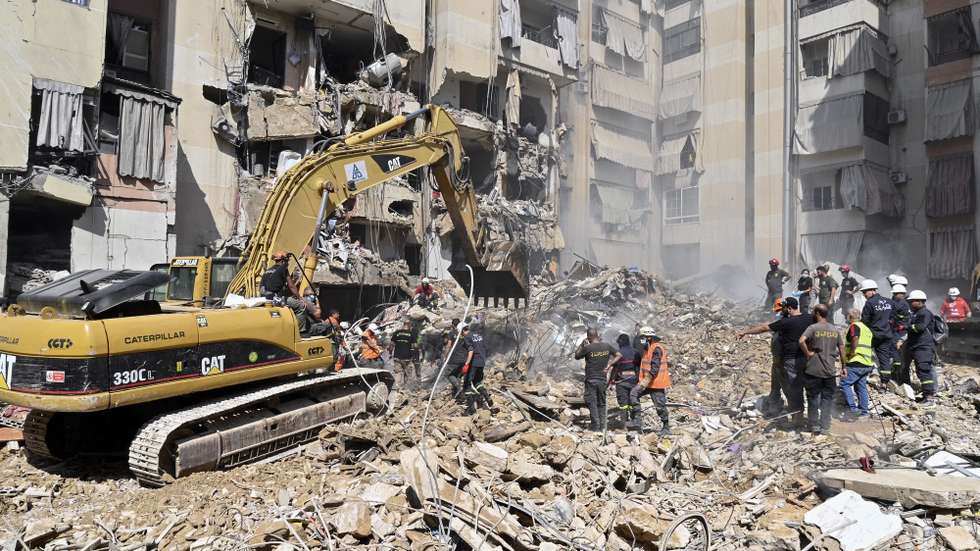 epa11616874 Emergency workers use an excavator to clear the rubble at the site which was targeted by an Israeli strike the previous day, in the southern suburb of Beirut, Lebanon, 21 September 2024. At least thirty-one people, including Hezbollah commander Ibrahim Akil, were killed and dozens injured in an attack which targeted the southern suburb of Beirut, according to the Lebanese Ministry of Health. The Israeli military stated on 20 September that it conducted a 'targeted strike' in Beirut, claiming that the 'Hezbollah Commanders we eliminated today' had been planning attacks on northern areas of Israel.  EPA/WAEL HAMZEH