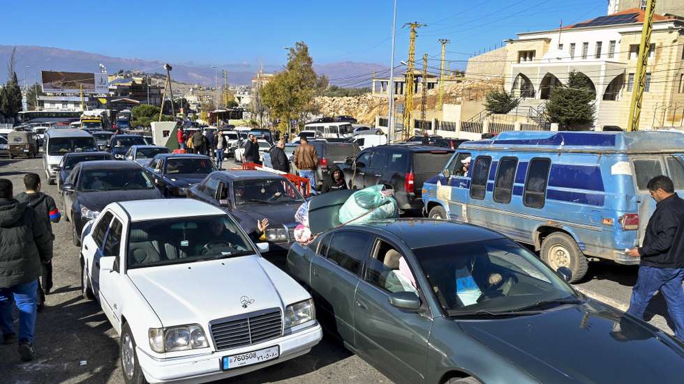 epa11776814 People in their cars wait at the Al-Masnaa crossing as they prepare to return to Syria, on the Lebanese-Syrian border, Lebanon, 14 December 2024, following the ouster of Syrian President Bashar al-Assad on 08 December 2024.  EPA/WAEL HAMZEH
