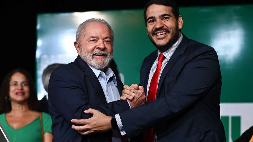 epa10376523 Brazil's President-elect, Luiz Inacio Lula da Silva, poses along with the appointed Minister of the Attorney General of the Union, Jorge Messias (R), during a press conference on the final report on the transition and to announce 16 Ministers of his future Government, in Brasilia, Brazil, 22 December 2022. Lula announced on 22 December 16 of his next ministers and included among them, as head of Industry and Commerce, the future vice president, Geraldo Alckmin. Lula will assume the Presidency on 01 January 2023 and has announced that he will increase the number of ministries to 37, compared to the 23 that the Government of the far-right Jair Bolsonaro had.  EPA/AndrÃ© Borges