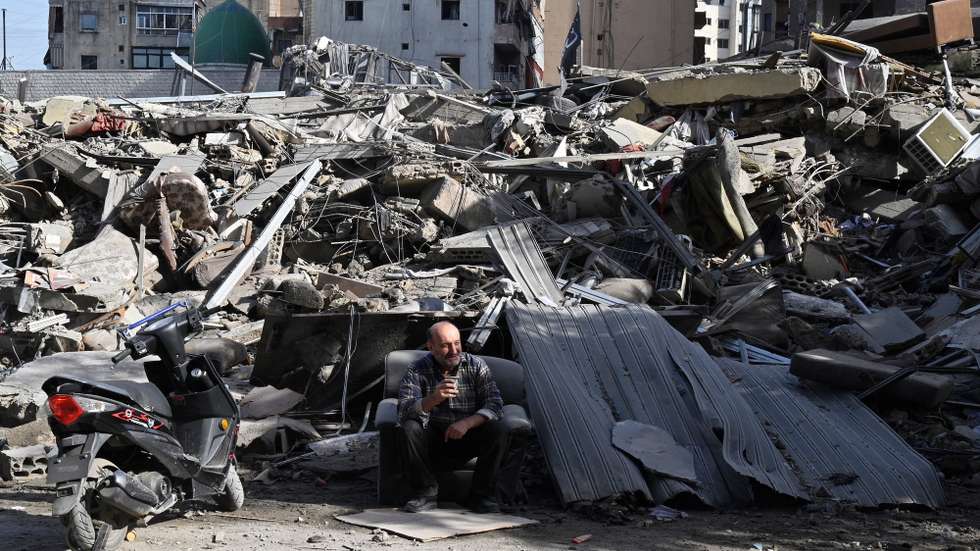 epa12549445 (FILE) - A man sits in front of a damaged building as displaced residents return following a ceasefire deal in Dahieh, southern Beirut, Lebanon, 29 November 2024. A 60-day ceasefire agreement between Israel and Hezbollah came into force on 27 November(reissued 26 November 2025). The Israel-Hezbollah ceasefire on 27 November 2024 marked a significant turning point after months of intense fighting, which began on 8 October 2024, following Hezbollah’s rocket attacks in solidarity with Hamas. The conflict resulted in thousands of casualties, massive displacement, and extensive destruction on both sides of the border.  EPA/WAEL HAMZEH