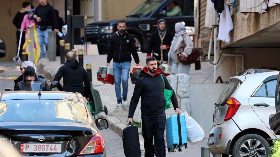 epaselect epa12805919 People carry their belongings after fleeing their homes following Israeli airstrikes in Beirut, Lebanon, 09 March 2026. The Israeli military stated it is conducting strikes across the country targeting Hezbollah infrastructure and personnel. According to the Disaster Management Unit of the Lebanese government, as of 08 March 2026, more than 115,000 people have been internally displaced in collective shelters in Lebanon since Israel resumed strikes on the country.  EPA/WAEL HAMZEH