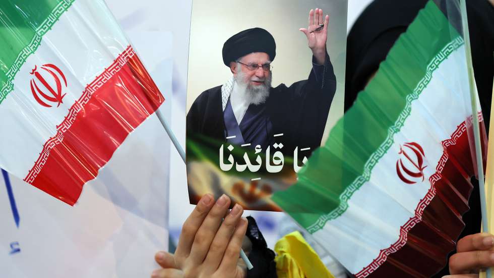 epaselect epa12682928 A Hezbollah supporter carries a portrait of the Iranian Supreme Leader Ayatollah Ali Khamene during a rally in solidarity with the Islamic Republic of Iran in the Dahieh suburb of Beirut, Lebanon, 26 January 2026. Thousands of supporters gathered to express solidarity with the Islamic Republic of Iran and condemn perceived 'insults and sabotage directed at Supreme Leader Ayatollah Ali Khamenei.  EPA/WAEL HAMZEH