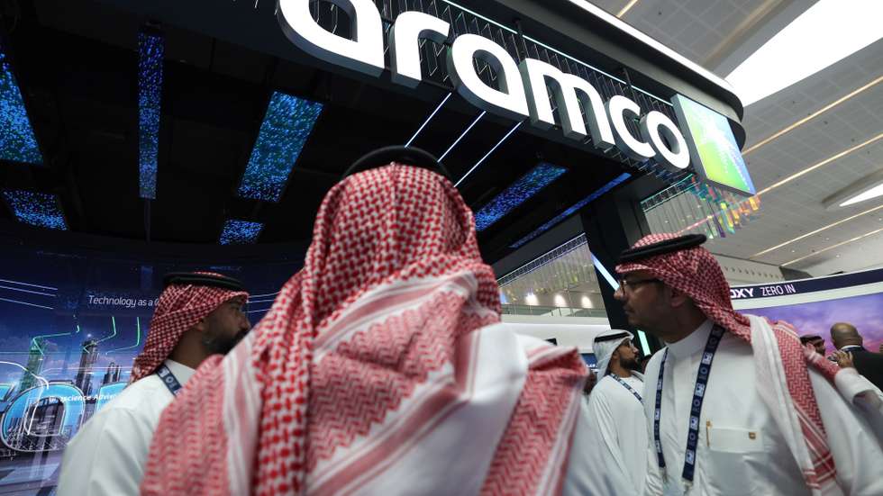 epa12500189 Visitors gather at the Saudi Arabian Oil Company (Aramco) stand during the Abu Dhabi International Petroleum Exhibition and Conference (ADIPEC) in Abu Dhabi, United Arab Emirates, 03 November 2025. ADIPEC 2025 runs from 03 to 06 November and features over 2,250 exhibitors, including 54 energy companies and 30 country pavilions.  EPA/ALI HAIDER