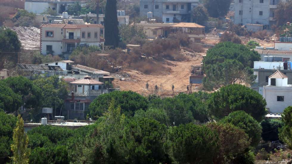 epa13166694 Israeli soldiers walk in the village of Zawtar al-Sharqiyah, as seen from Zawtar al-Gharbiya, southern Lebanon, 13 August 2026. Zawtar al-Gharbiya is among the designated pilot zones under the ceasefire agreement between Lebanon and Israel, from which Israeli forces have withdrawn.  EPA/WAEL HAMZEH