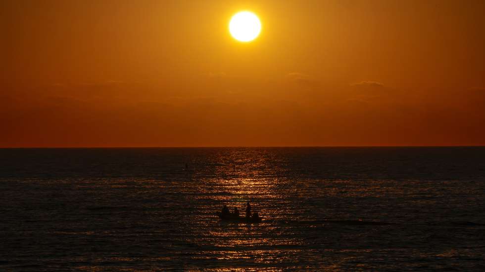 epa13078558 A boat sails during sunset on the coast of the Mediterranean Sea, in Beirut, Lebanon, 01 July 2026.  EPA/WAEL HAMZEH