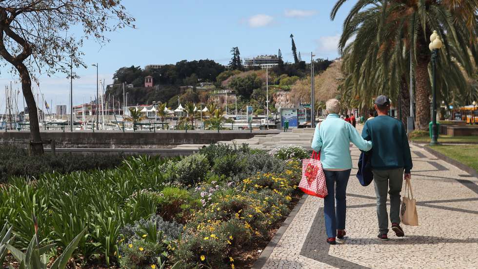 epa08312087 A couple walk along the Marginal of Funchal without people due to the epidemic of covid-19, Madeira Island, Portugal, 21 March 2020. In Portugal, there are 12 deaths and 1,280 confirmed infections. Portugal is in a state of emergency from 00:00 on March 19th until 23:59 on 02 April. Countries around the world are taking increased measures to stem the widespread of the SARS-CoV-2 coronavirus which causes the Covid-19 disease.  EPA/HOMEM DE GOUVEIA
