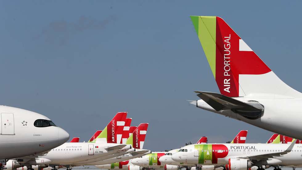 epa08524023 A TAP Air Portugal aircraft grounded at Humberto Delgado airport closed for passenger traffic as part of the exceptional traffic measures to combat the epidemiological situation of Covid-19, in Lisbon, Portugal, 09 April 2020 (reissued 02 July 2020). The granting of state support to TAP has been under discussion since the airline's activity came to a standstill because of the coronavirus pandemic, with an agreed injection of up to 1,200 million euros.  EPA/MANUEL DE ALMEIDA