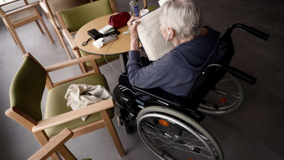 epaselect epa08356843 A resident sits in a wheelchair while reading a Spanish translation of the popular book 'The Adventures of Sherlock Holmes' by Sir Arthur Conan Doyle in a common area of the Casablanca retirement home in the working-class district of Villaverde, Madrid, Spain, 11 April 2020. Despite almost all countries adopting specific measures to protect nursing homes from the ongoing pandemic of the COVID-19 disease caused by the SARS-CoV-2 coronavirus, they have become one of the main foci of infection, with their elderly residents constituting the main at-risk group that is especially vulnerable to the virus' devastating spread. Retirement homes across Spain are recording some of the highest figures when it comes to COVID-19 infections and mortality rates.  EPA/MARISCAL