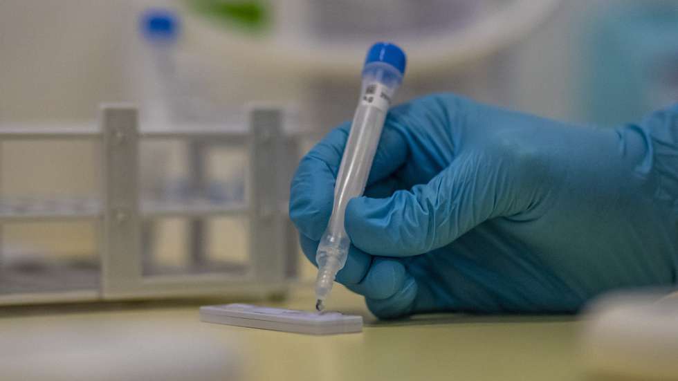 epa08887535 A medical worker collects a swab sample during free antigen coronavirus testing at Motol University Hospital in Prague, Czech Republic, 16 December 2020.  Starting from 16 December, people who want to get tested for COVID19 will get it for free. Czech government originally planned the health insurance covering COVID19 testing on voluntary basis to begin on 18 December but decided to start earlier than planned. Czech media reported, the capacity will be up to 60,000 tests per day. Due to the anticipated frequent visits of families, the start of testing is scheduled before Christmas holidays and is expected to run until 15 January 2021.  EPA/MARTIN DIVISEK
