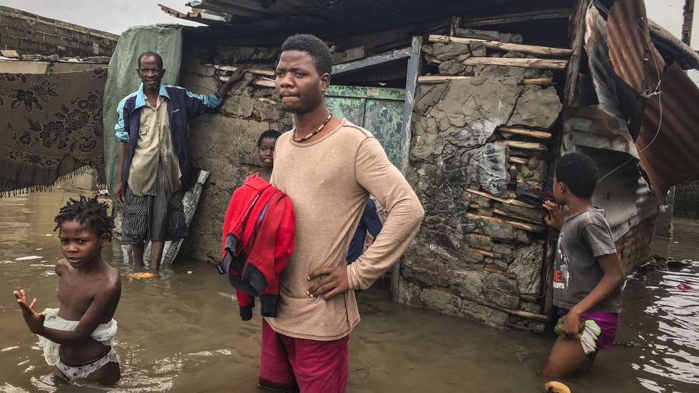 epa08960206 A man observes the damage caused by the passage of Tropical Cyclone Eloise caused  after the passage of Tropical Cyclone Eloise at a street in the city of Beira, Mozambique, 23 January 2021.The city of Beira presented signs of destruction, with several flooded neighborhoods with residents circulating with the water reaching their waist at some points following the passage of Tropical Cyclone Eloise.  EPA/ANDRE CATUEIRA