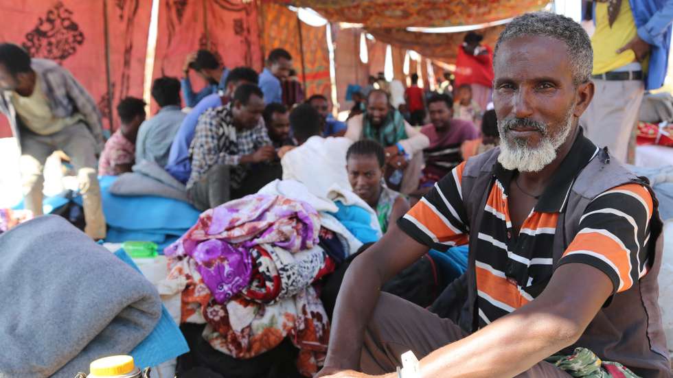 epa08845725 A handout photo dated 18 November 2020 and made available by the World Food Programme, WFP, on 27 November 2020 showing Ethiopians fleeing intense fighting in their homeland of Tigray, gathering in the neighbouring Sudanese Um Rakuba Refugee Camp, Gedaref State, Sudan. WFP is providing food for Ethiopian refugees who are being resettled in Um Rakuba Refugee Camp in Gedaref State, Sudan after crossing the border from Ethiopia. People who newly arrive are receiving hot meals and high energy biscuits and will receive one month of dry rations including lentils, sorghum, oil and salt once they receive cooking utensils to prepare their own food.  EPA/WFP / LENI KINZLI HANDOUT  HANDOUT EDITORIAL USE ONLY/NO SALES