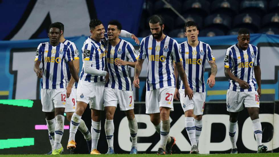 epa08980457 FC Porto players celebrate after scoring a goal during the Portuguese First League soccer match FC Porto vs Rio Ave held at Dragao Stadium, Porto, Portugal, 01 February 2021.  EPA/ESTELA SILVA