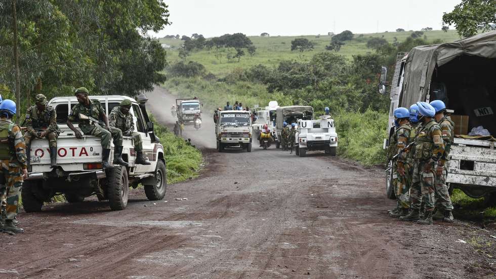 epa09030027 United Nations and Congo Armed Forces soldiers secure a road near the scene of an attack on the edge of the Virunga National Park where Italy's ambassador to the Democratic Republic of Congo and two others were killed, in Nyiragongo, North Kivu province,  Democratic Republic of Congo, 22 February 2021. According to the Italian Foreign Ministry, the Italian Ambassador to the DR Congo, Luca Attanasio, and a security member were killed in an apparent attack on a UN convoy near Goma, Democratic Republic of the Congo. A statement by the World Food Programme (WFP) said that a WFP driver was also among the dead.  EPA/STR