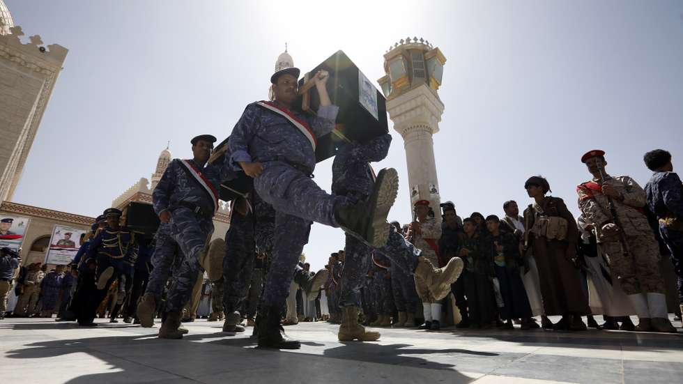 epa09091201 Pro-Houthi soldiers carry the coffins of slain Houthi fighters during a funeral procession a day after a Yemen peace initiative was offered by Saudi Arabia, in Sana'a, Yemen, 23 March 2021. Saudi Arabia has offered a peace initiative to the Houthis in Yemen, including a ceasefire and the reopening of Sana’a airport. A Saudi-led coalition has been fighting the Houthis since March 2015.  EPA/YAHYA ARHAB