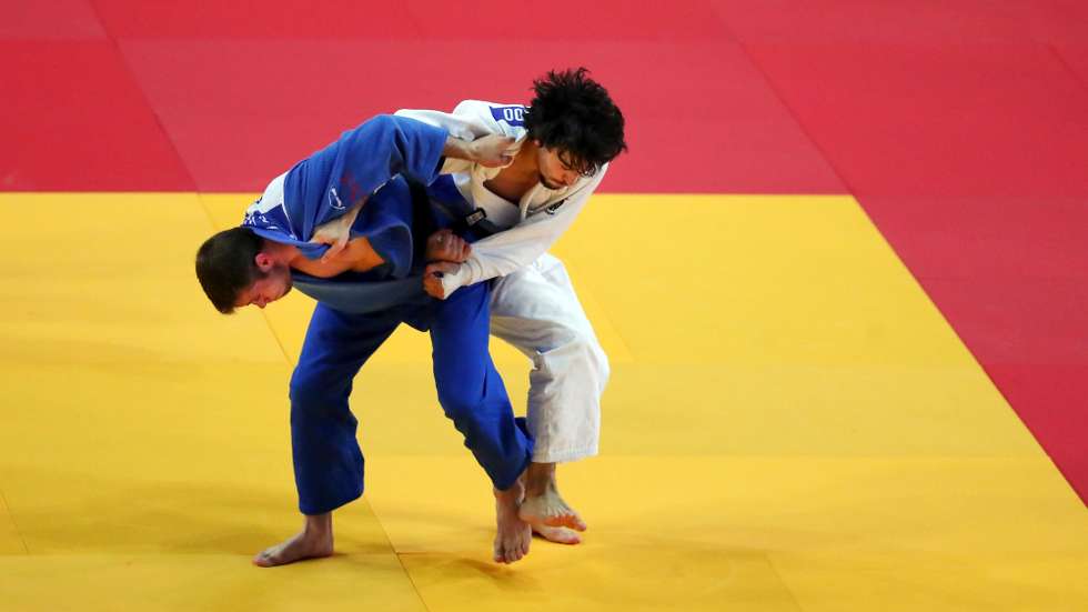 João Fernando of Portugal (white) and Martin Hojak of Slovenia (blue), in action during second round match in the men's -73kg category at the European Judo Championships in Lisbon, Portugal, 17 April 2021. NUNO VEIGA/LUSA