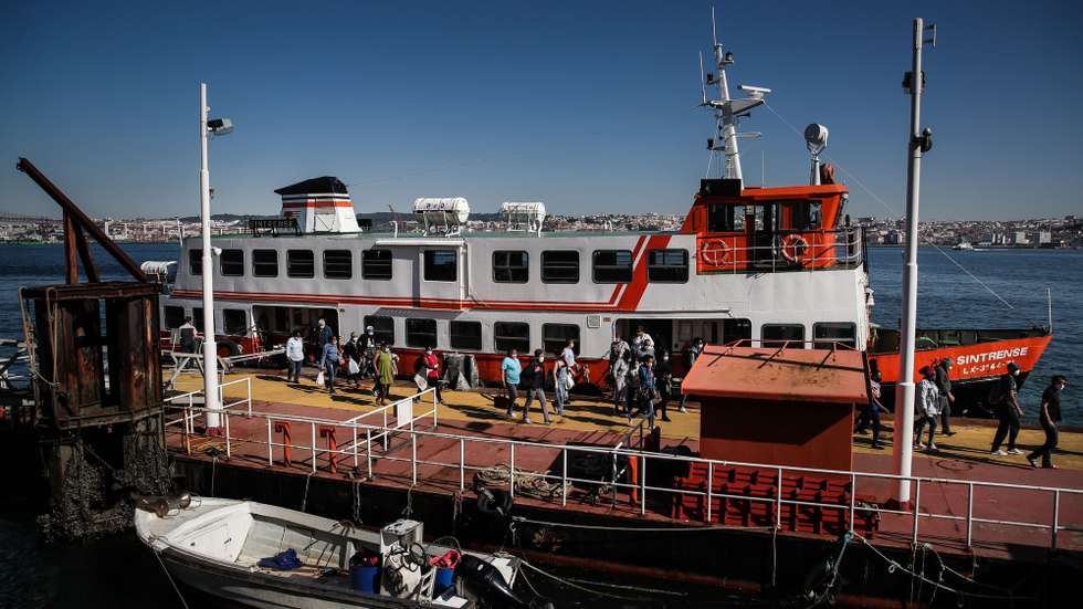 People disembark from a ferryboat 'cacilheiro' coming from Lisbon at Cacilhas station, Almada, Portugal, 20 May 2020. Public transportation has been strengthened with the entry of the second phase of deconfinement due to the covid-19 pandemic, despite this, careers are still short, which contrasts with the large use of river transport by Transtejo/Soflusa. MARIO CRUZ/LUSA
